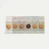Foto de las cajas de los seis sabores de galletas sin gluten de Milola con la galleta de zanahoria especiada resaltada.